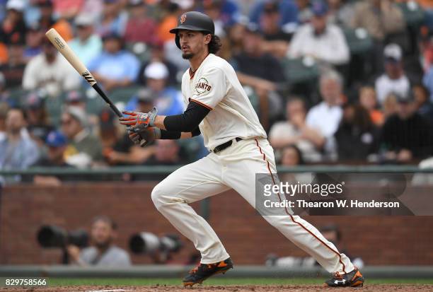 Jarrett Parker of the San Francisco Giants hits an rbi single scoring Denard Span against the Chicago Cubs in the bottom of the seventh inning at...