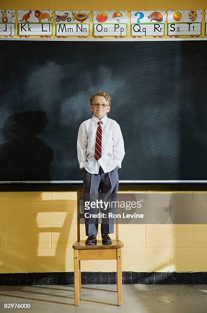 grade 1 student in classroom - blackboard qc stock pictures, royalty-free photos & images