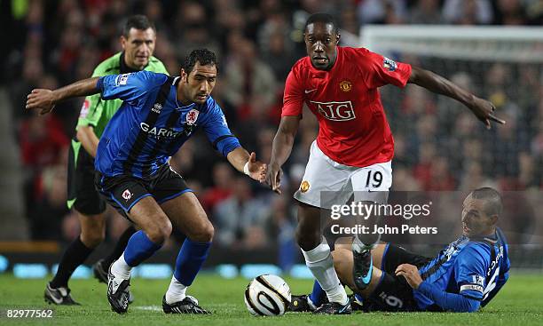 Danny Welbeck of Manchester United clashes with Mohamed Shawky and Emanuel Pogatetz of Middlesbrough during the Carling Cup third round match between...