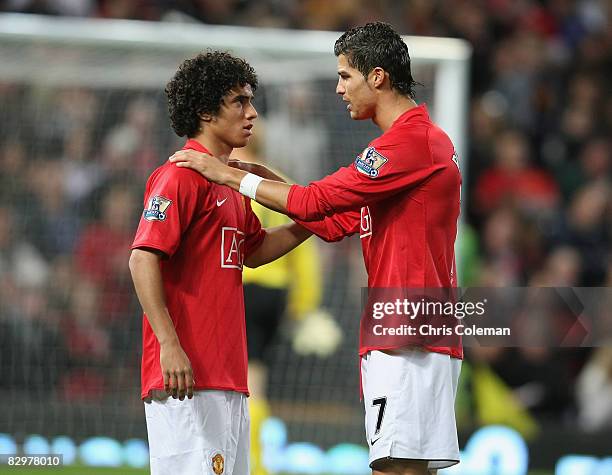 Cristiano Ronaldo of Manchester United speaks to Rafael Da Silva ahead of the Carling Cup third round match between Manchester United and...