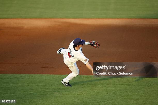 Jason Donald in action, making diving throw to 1st base vs Canada during pre-Olympic exhibition game at USA Baseball National Training Complex. Cary,...