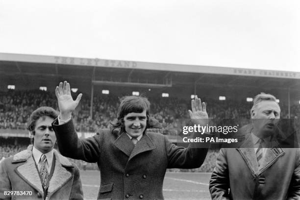 Ian Storey-Moore acknowledges the cheers of the Derby County fans as he is introduced to the crowd by Derby secretary Stuart Webb and assistant...