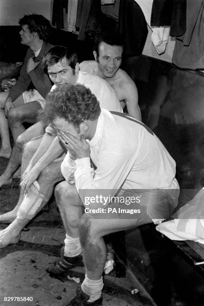 An exhausted Billy Bremner of Leeds United recovers in the dressing room after scoring the winning goal, to the delight of teammates Paul Reaney ,...