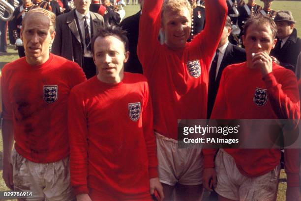 Exhausted England players Bobby Charlton, Nobby Stiles, Bobby Moore and Ray Wilson after the game
