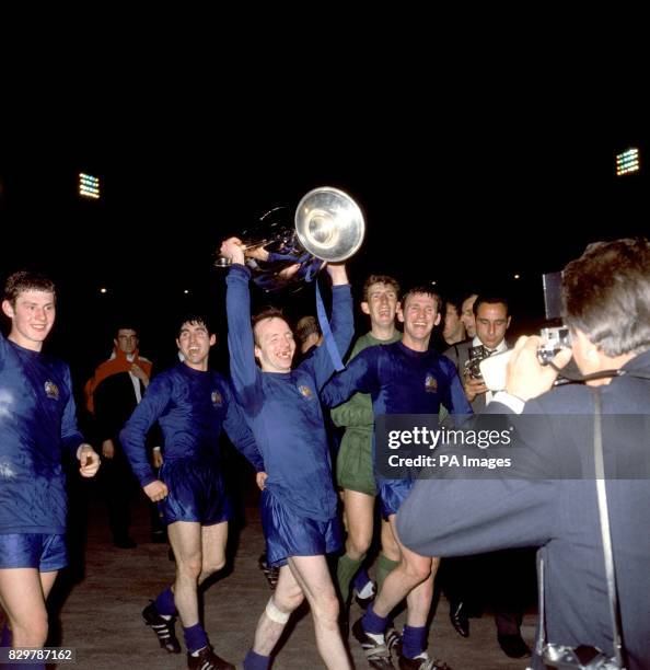 Manchester United's Nobby Stiles celebrates with the European Cup after his team's 4-1 win as he and his teammates perform a lap of honour: Brian...