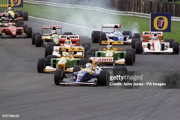Nigel Mansell in the Williams-Renault, briefly behind teammate Riccardo Patrese at Copse, on his way to winning the British Grand Prix. Great...