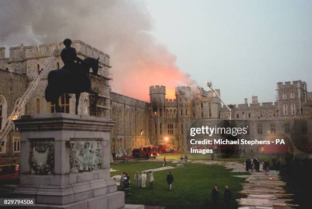 The scene at Windsor Castle as dusk falls after the fire swept through the royal home.