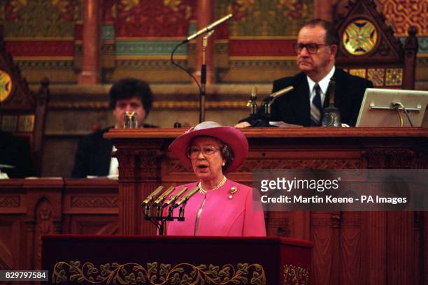 BRITAIN'S QUEEN ELIZABETH ADDRESSES THE HUNGARIAN PARLIAMENT IN BUDAPEST, UNDER THE GAZE OF ITS SPEAKER, DR GYORGY SZABAD. IT WAS THE FIRST TIME THAT...