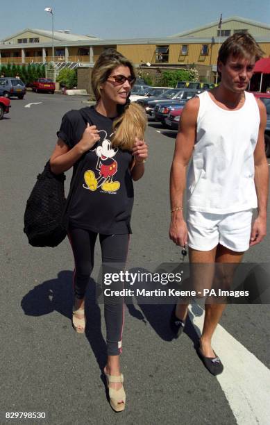 MODEL MANDY SMITH AND SPURS FOOTBALLER PAT VAN DEN HAUWE, WHO MARRIED EARLIER THIS MONTH, WALK BACK TO THEIR CAR AFTER LUNCH AT THE DAVID LLOYD CLUB...