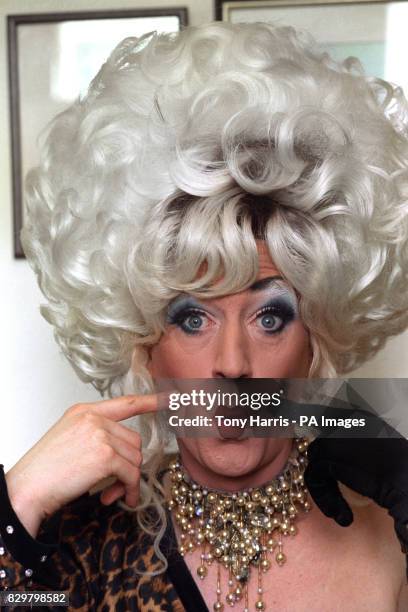 PAUL O'GRADY ALIAS DRAG QUEEN ARTIST, LILY SAVAGE AT HIS HONE, A COUNCIL FLAT IN SOUTH LONDON.