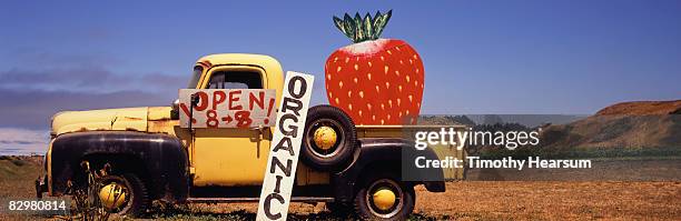 old truck with giant strawberry - davenport california stock pictures, royalty-free photos & images