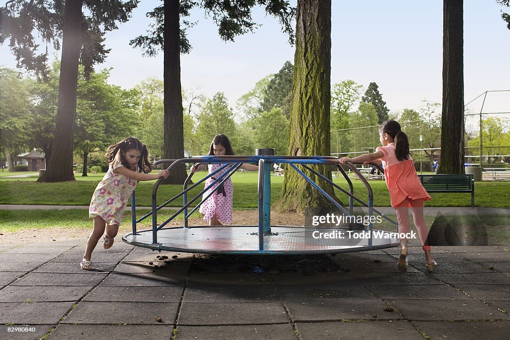 Kids on carousal in playground