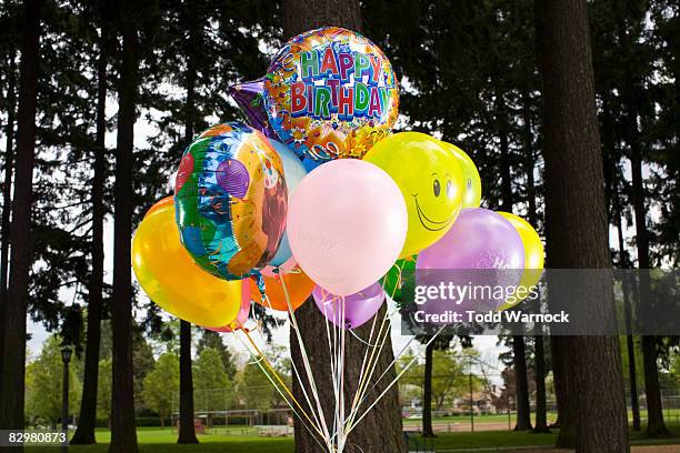 happy birthday balloons - helium balloon stock pictures, royalty-free photos & images