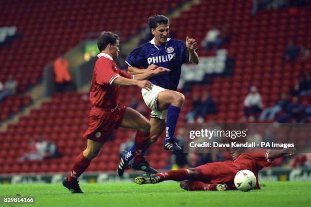 PSV EINDHOVEN'S LUC NILIS AVOIDS A TACKLE FROM LIVERPOOL'S PHIL BABB AND TRIES A SHOT AT GOAL IN THE JAN MOLBY TESTIMONIAL AT ANFIELD.