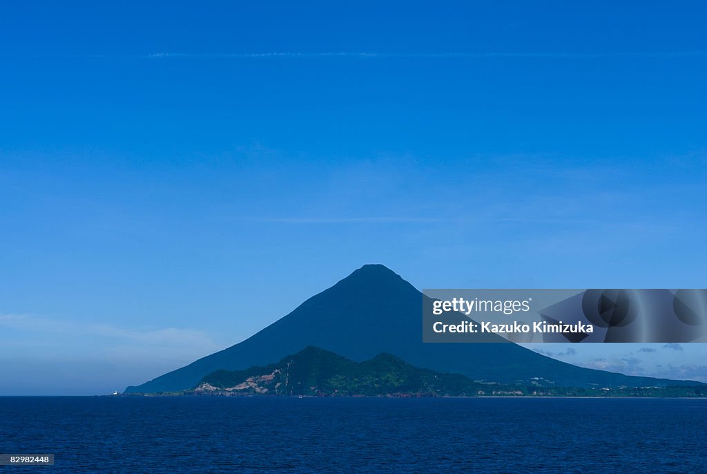 Mt.Kaimondake from seaside,with vapor trail