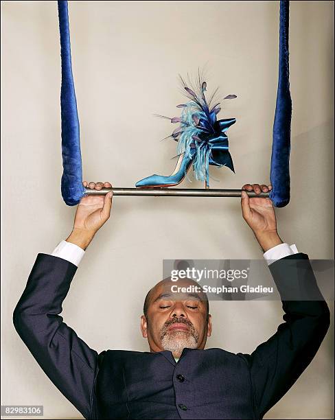 Designer Christian Louboutin poses at a portrait session in Paris on July 1, 2008. .