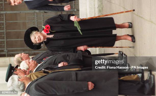 File picture dated 9.11.95 the Queen Mother, walking with the aid of two sticks, meets veterans during a ceremony at the Field of Rememberance in St...