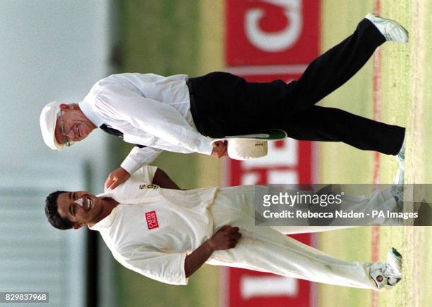 Umpire Cyril Mitchley puts an arm on the shoulder of South African spin bowler Paul Adams, during the 4th Test at St. George's Park, Port Elizabeth.