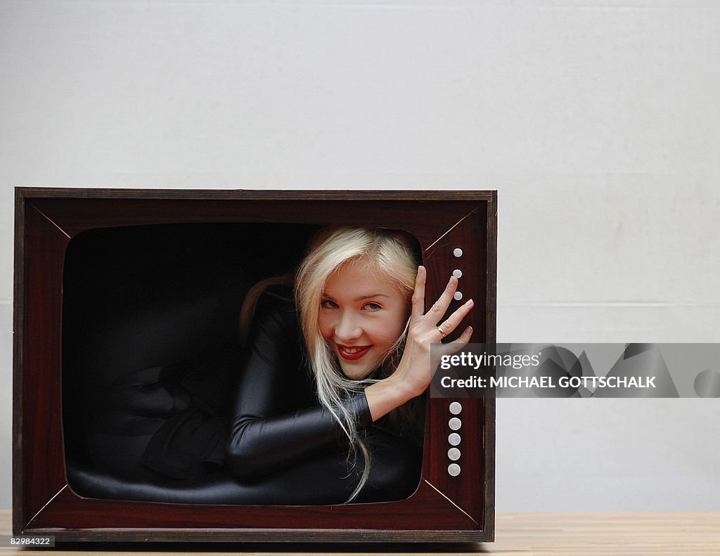 Contortionist Zlata poses into a fake bo