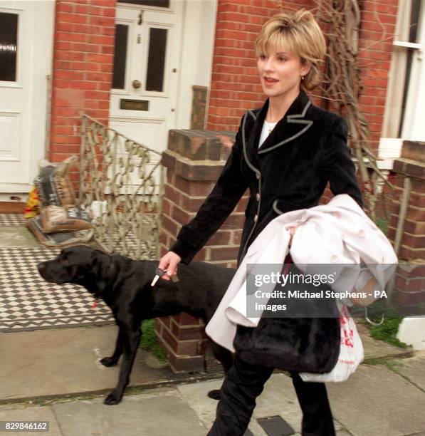 Julia Carling, estranged wife of England rugby star Will Carling, walks her dog Biff outside her home in Putney, southwest London. Allegations about...