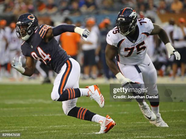 Leonard Floyd of the Chicago Bears rushes past Menelik Watson of the Denver Broncos during a preseason game at Soldier Field on August 10, 2017 in...