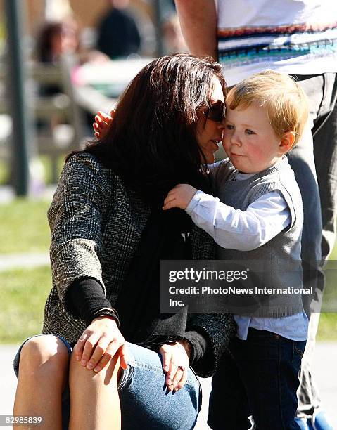 Crown Princess Mary sits with Prince Christian during a family day out at the Salamanca Arts Centre on August 25, 2008 in Hobart, Tasmania. The royal...