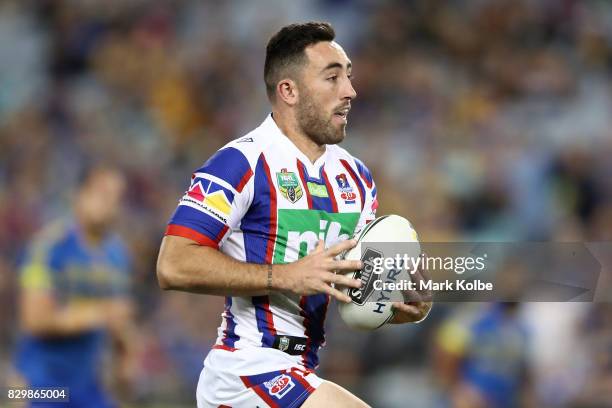 Brock Lamb of the Knights makes a break during the round 23 NRL match between the Parramatta Eels and the Newcastle Knights at ANZ Stadium on August...