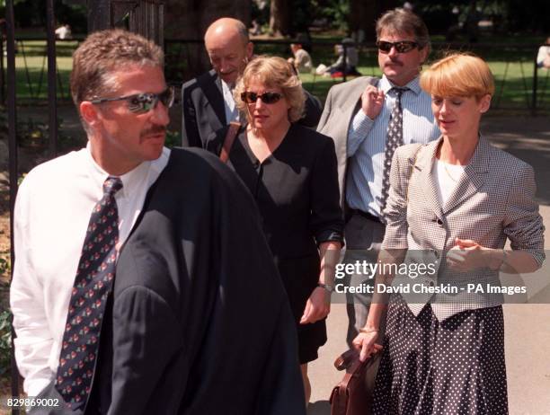 Ian and Kathy Botham and Allan and Lindsay Lamb take a break from the High Court today , where the former England cricketing colleagues are suing...