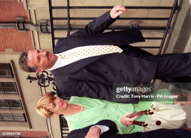Former England cricket allrounder Ian Botham accompanied by his wife Kathy leaving the High Court in London after losing his libel case against...