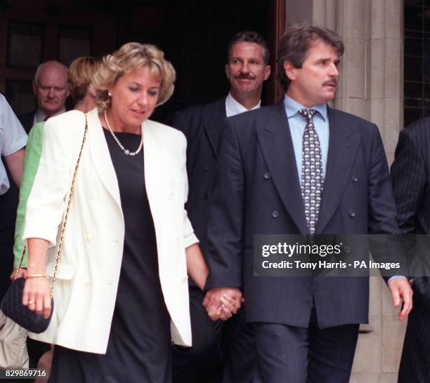 Former England cricket allrounder Ian Botham accompanied by his wife Kathy follows former team-mate Alan Lamb and his wife Lindsay from the High...