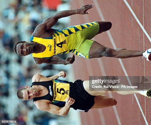 Linford Christie can only watch as he comes third in the 100m sprint, with Ian Mackie taking second place, at the McDonald's Games athletics meeting...