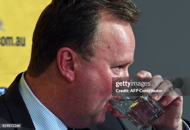 Bill Pulver, CEO of the Australian Rugby Union, takes a sip as he listens to a question during a press conference at ARU headquarters in Sydney on...
