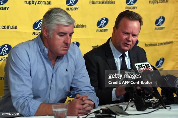 Australian Rugby Union chairman Cameron Clyne listens as Bill Pulver , CEO of the ARU, speaks during a press conference at ARU headquarters in Sydney...