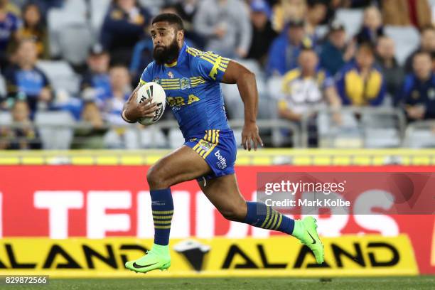 Michael Jennings of the Eels makes a break during the round 23 NRL match between the Parramatta Eels and the Newcastle Knights at ANZ Stadium on...