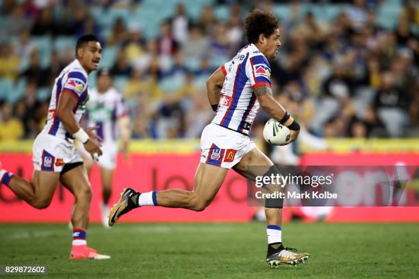 Dane Gagai of the Knights runs the ball during the round 23 NRL match between the Parramatta Eels and the Newcastle Knights at ANZ Stadium on August...