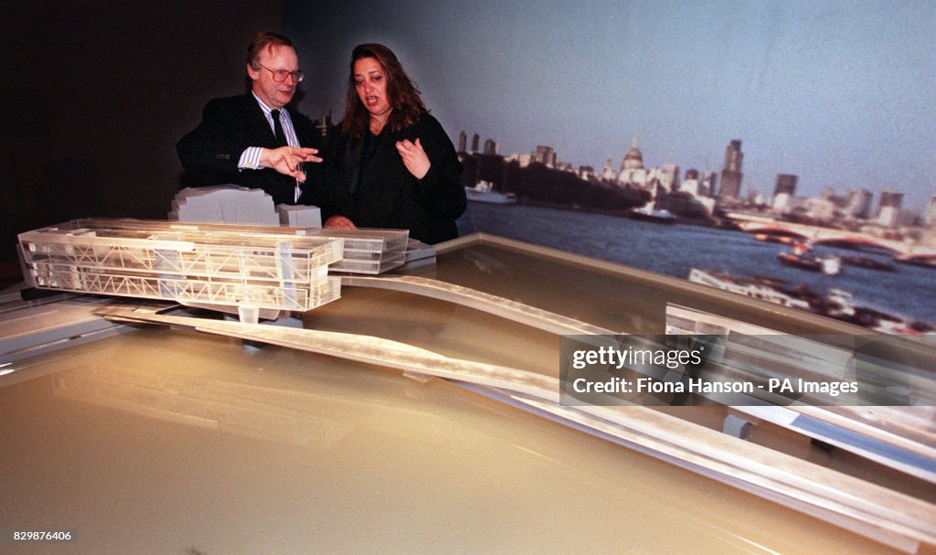 Secretary of State for the Environment John Gummer with Zaha M. Hadid who was today (Tue) named as joint winner of the Thames Water Habitable Bridge Competition to design a new inhabited bridge across the River Thames. The proposed site of the bridge is from Temple Gardens to the area in front of the London Television Centre on the south bank. Watch for PA story. Photo by Fiona Hanson/PA.   (Photo by Fiona Hanson - PA Images/PA Images via Getty Images)