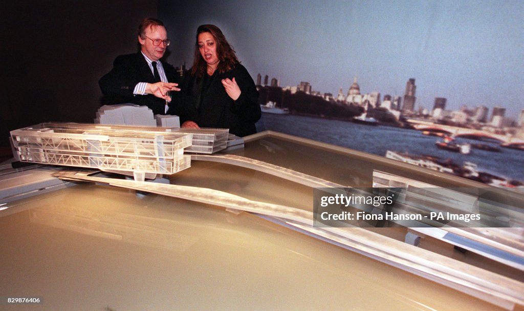 Secretary of State for the Environment John Gummer with Zaha M. Hadid who was today (Tue) named as joint winner of the Thames Water Habitable Bridge Competition to design a new inhabited bridge across the River Thames. The proposed site of the bridge is from Temple Gardens to the area in front of the London Television Centre on the south bank. Watch for PA story. Photo by Fiona Hanson/PA. (Photo by Fiona Hanson - PA Images/PA Images via Getty Images)