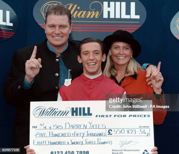 Darren Yates, whose accumulator bet won him 550,823.54p pictured here with his wife Annaley and jockey Frankie Dettori, who won all seven of his...
