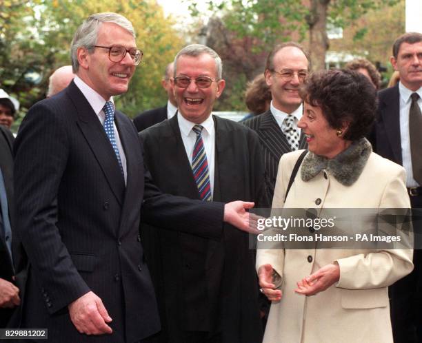 Prime Minister John Major shares a jokes with his Education Secretary Gillian Shephard on their arrival at the Cardinal Vaughan Memorial School in...