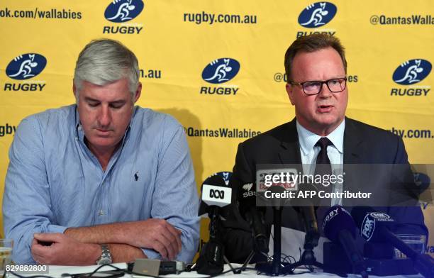 Australian Rugby Union chairman Cameron Clyne listens as Bill Pulver , CEO of the ARU, speaks during a press conference at ARU headquarters in Sydney...