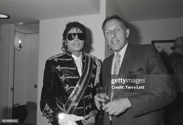 Michael Jackson talking to Maurice Oberstein whilst in London to accept a gold disc for the 'Thriller' album, London, 1983.