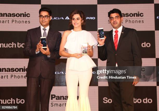 Bollywood actor Taapsee Pannu flanked by President & CEO, Panasonic India & South Asia, Manish Sharma and Business Head, Mobility Division, Panasonic...