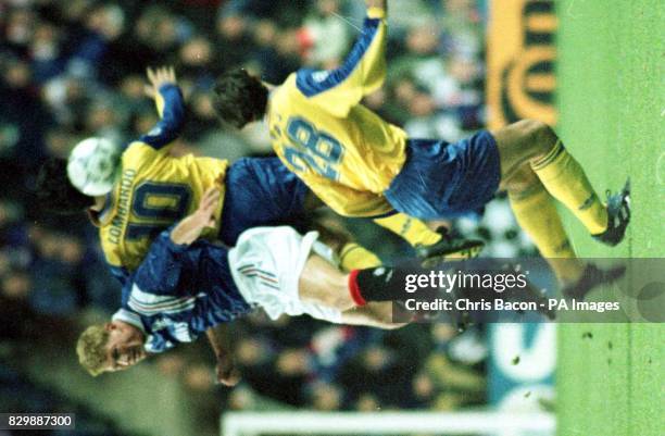 Rangers' Peter Van Vossen heads the ball clear from Massimo Lombardo of Grasshopper during the UEFA Championship League at Ibrox Glasgow tonight...