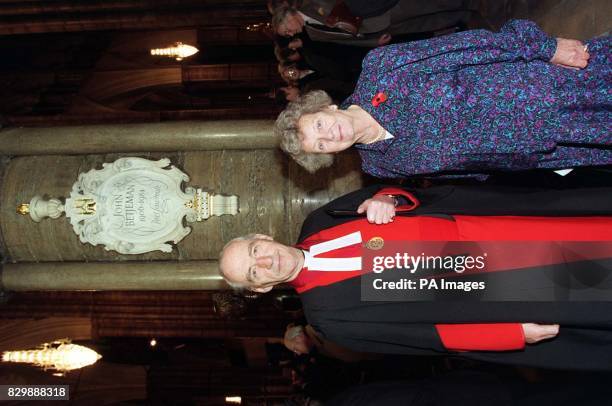 The Dean of Westminster and Lady Wilson of Rievaulx stand beneathe the stone tablet dedicated to Sir John Betjeman at Poet's Corner, Westminster...