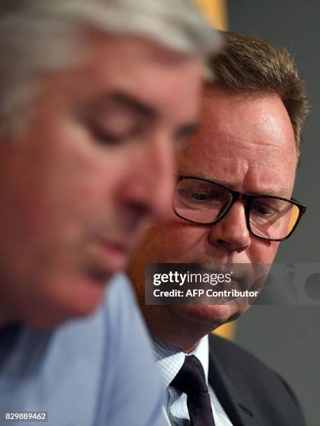 Australian Rugby Union chairman Cameron Clyne speaks as Bill Pulver , CEO of the ARU, looks on at a press conference at ARU headquarters in Sydney on...
