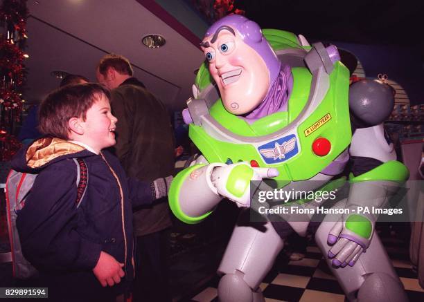 Alec de Sausmarez comes face to face with his hero Buzz Lightyear as he joined the throng of customers battling it out this morning at the Disney...