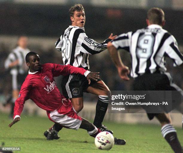 Newcastle United goalscorer Lee Clark moves past Keith Jones of Charlton in their FA Cup Replay at St James's Park tonight . Photo Owen Humphreys.PA.