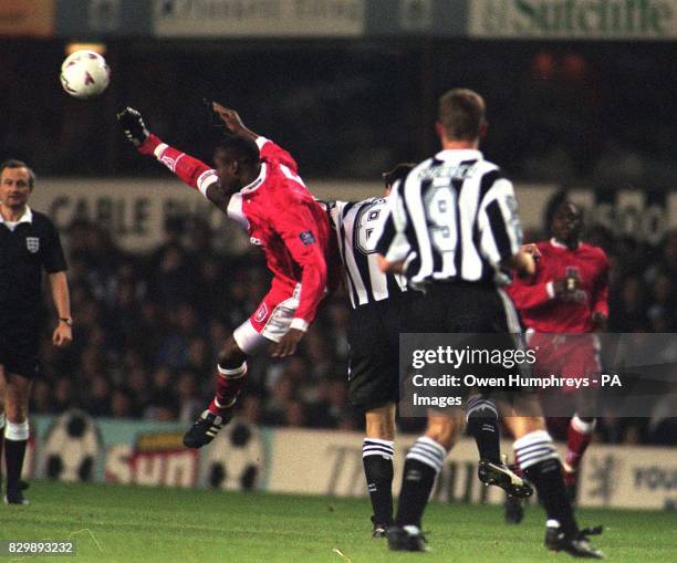 Charlton's Keith Jones climbs high above Newcastle's goal scorer Lee Clark during the FA Cup replay at St James's Park tonight . Photo Owen...