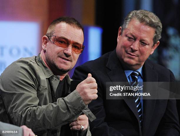 Bono , lead singer U2 speaks as former US Vice-President Al Gore listens at the Clinton Global Initiative September 24, 2008 in New York. The...