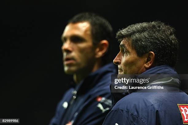Tottenham Hotspur Manager Juande Ramos and Assistant Gus Poyet look on prior to the Carling Cup Third Round match between Newcastle United and...